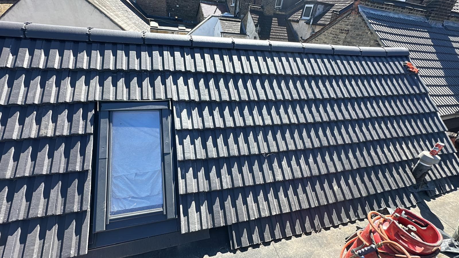 Grey tile roof with Velux skylight